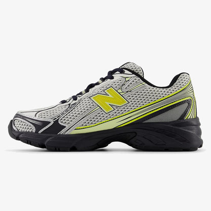White, black, and yellow DIDALUXE sneaker with silver overlay details
